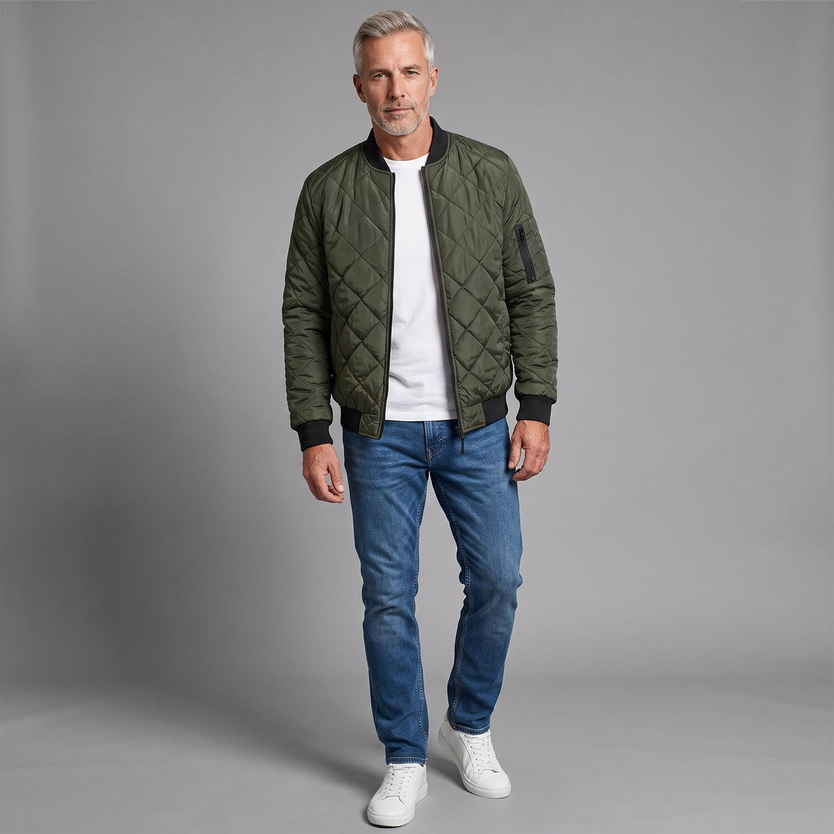 Men's diamond-quilted bomber jacket in dark green, full-body standing shot