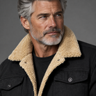 Men's sherpa-lined trucker jacket, close-up of sherpa collar texture, gray studio background