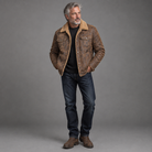 Men's vegan suede sherpa-lined jacket, full-body standing shot, gray studio background