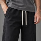 Men's cotton relaxed pants, close-up of fabric and drawstring waist