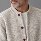 Men's knit relaxed cardigan, close-up of knit texture and buttons