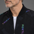 Men's printed bomber jacket, close-up of ribbed collar and print detail