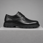 Men's leather round-toe derby shoes, straight-on gray pedestal shot
