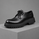 Men's faux leather lug-sole derby shoes, 3/4 angle gray pedestal shot